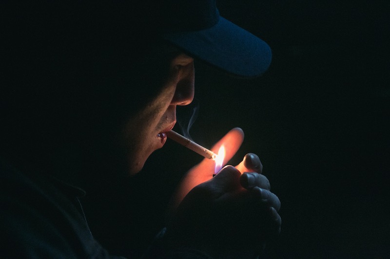 A man smoking a cigarette