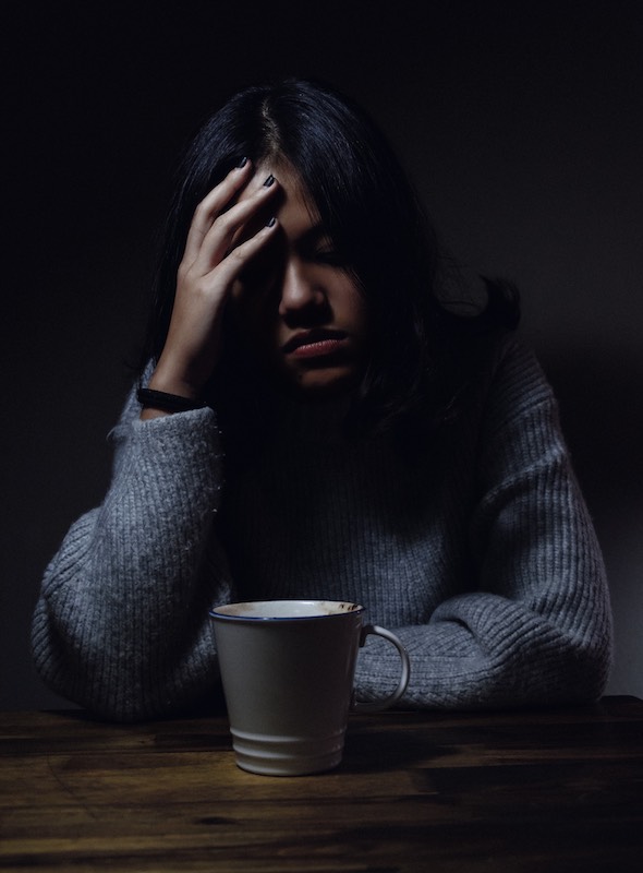 A woman drinking coffee